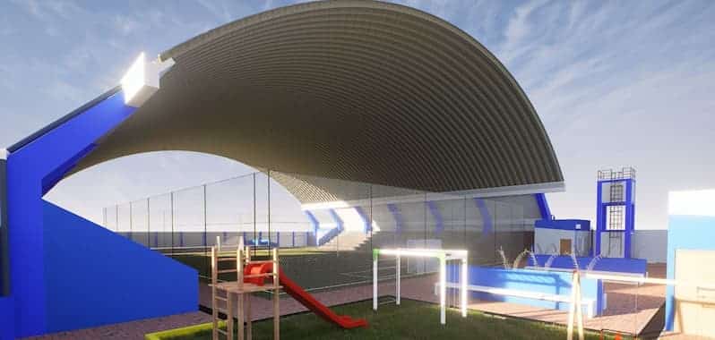 La imagen muestra el diseño de un polideportivo en Chulucanas, Piura. Se observa una cancha techada, áreas recreativas y espacios destinados para la práctica deportiva.