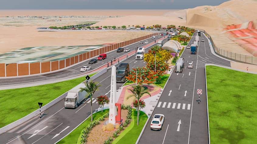 Render de una moderna vía en construcción en Tacna, Perú, con carriles amplios, zonas verdes, señalización clara y áreas peatonales. La avenida está rodeada por paisajismo urbano con árboles, monumentos y pasos peatonales, en un entorno desértico con colinas al fondo.